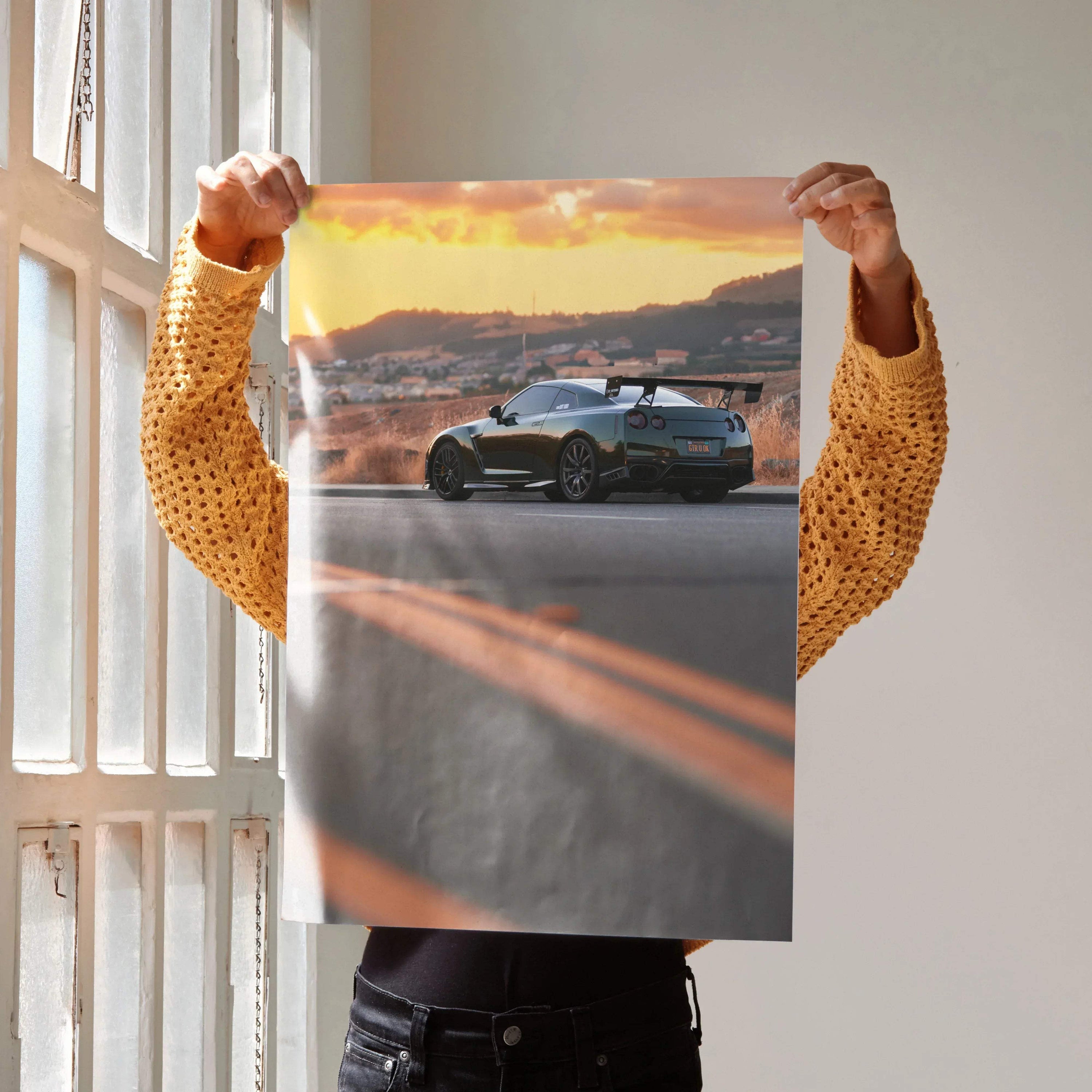 Nissan GTR R35 parked on road at sunset poster wall art with vibrant sky colors.