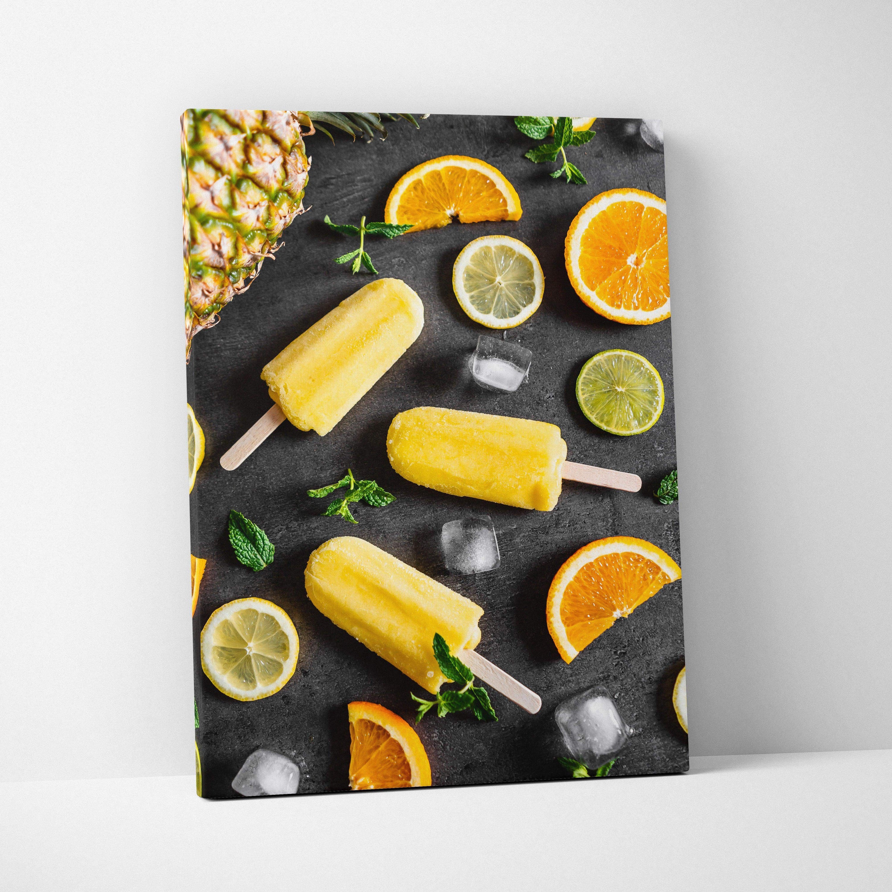 Canvas wall art featuring vibrant lemon and lime popsicles with citrus slices and mint on a dark background.