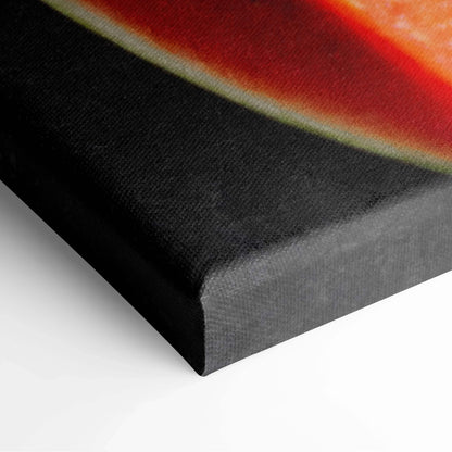 Close-up of vibrant watermelon slice canvas wall art with rich red, green, and black hues on textured fabric.