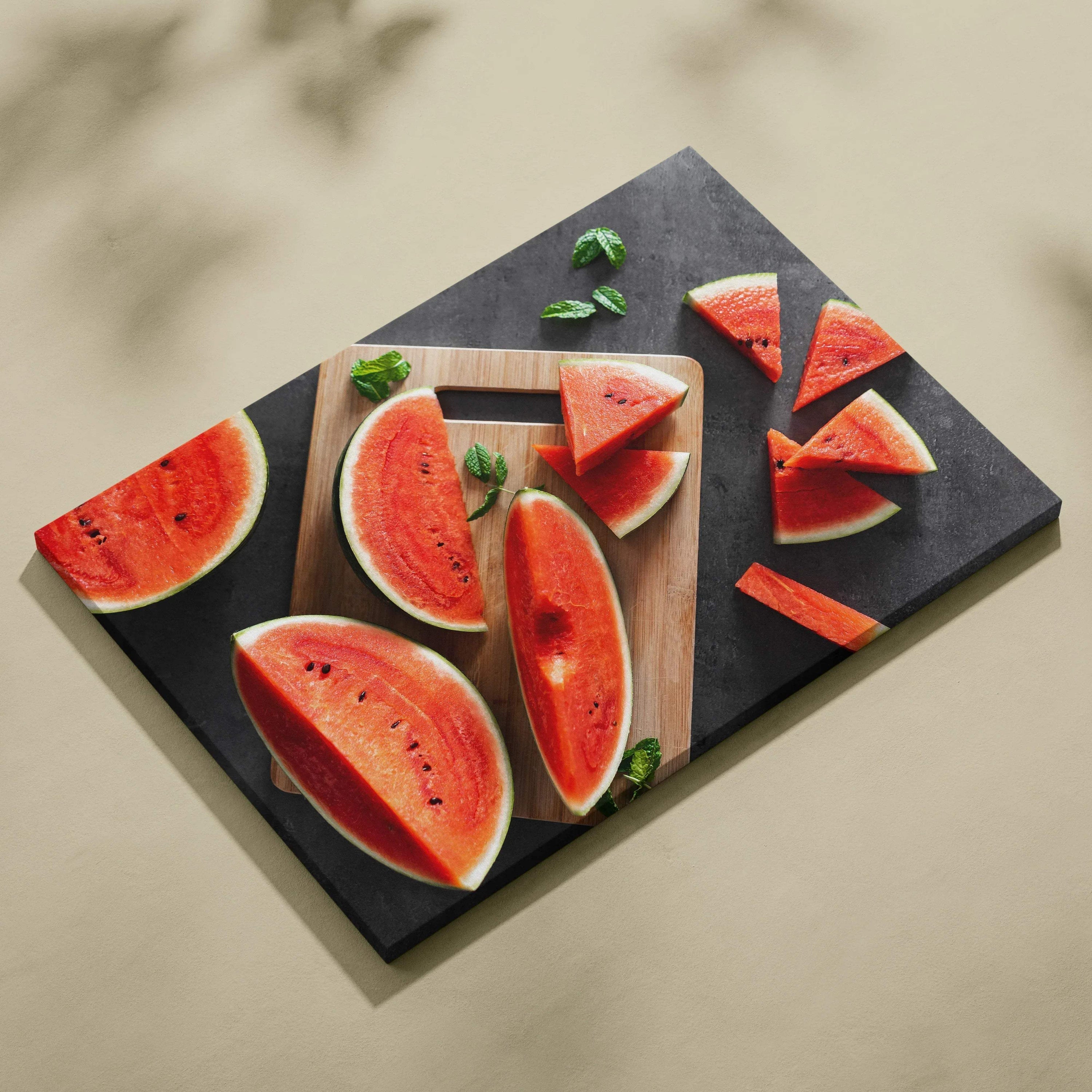 Vibrant canvas wall art featuring realistic sliced watermelon with red flesh and green rind on a dark background.