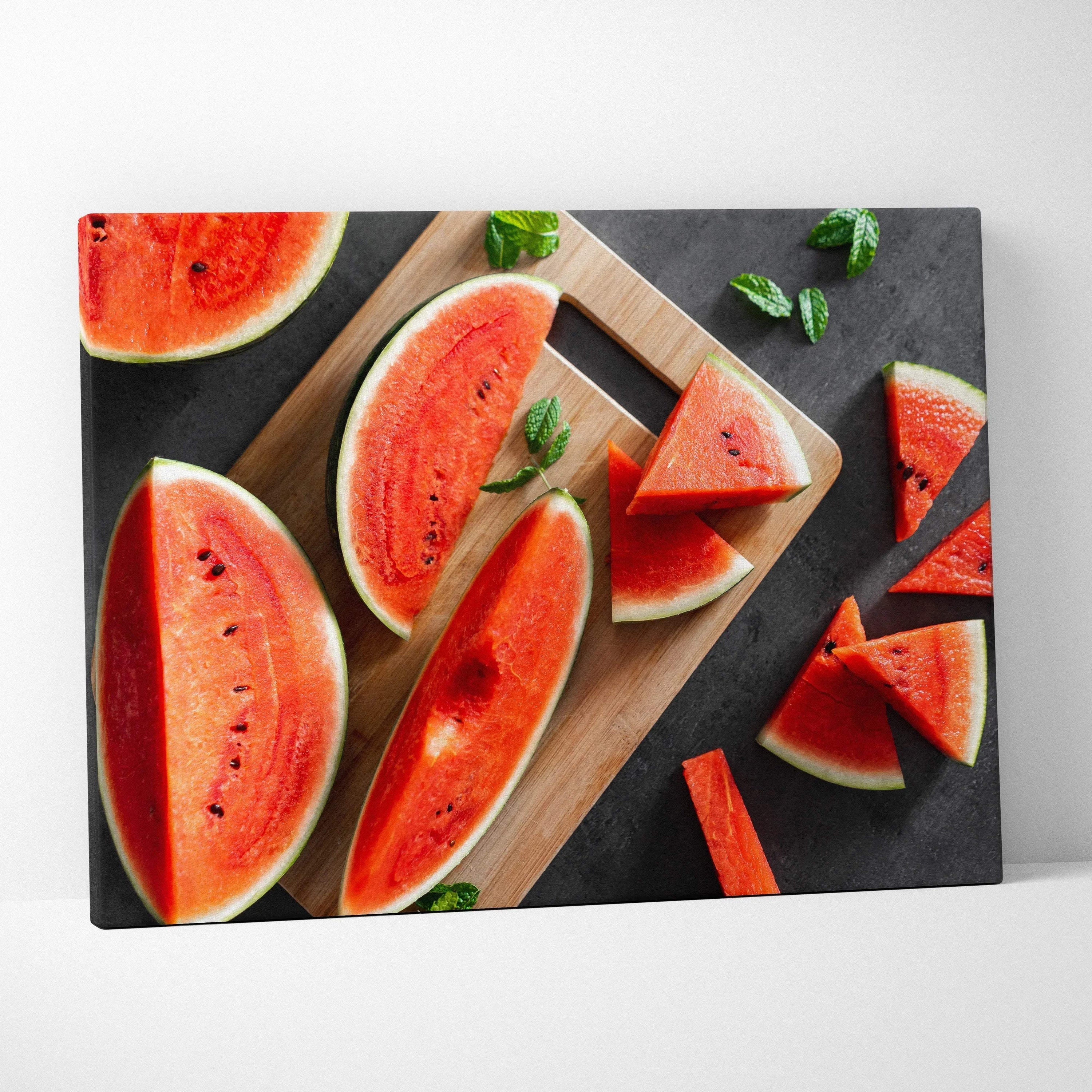 Canvas wall art featuring vibrant red watermelon slices with black seeds on a dark background with green mint leaves.