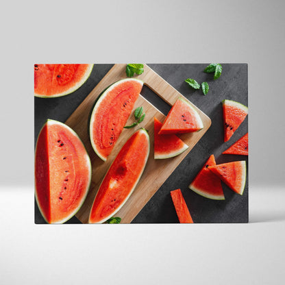 Canvas wall art featuring vibrant red watermelon slices with black seeds on a wooden cutting board and dark background.