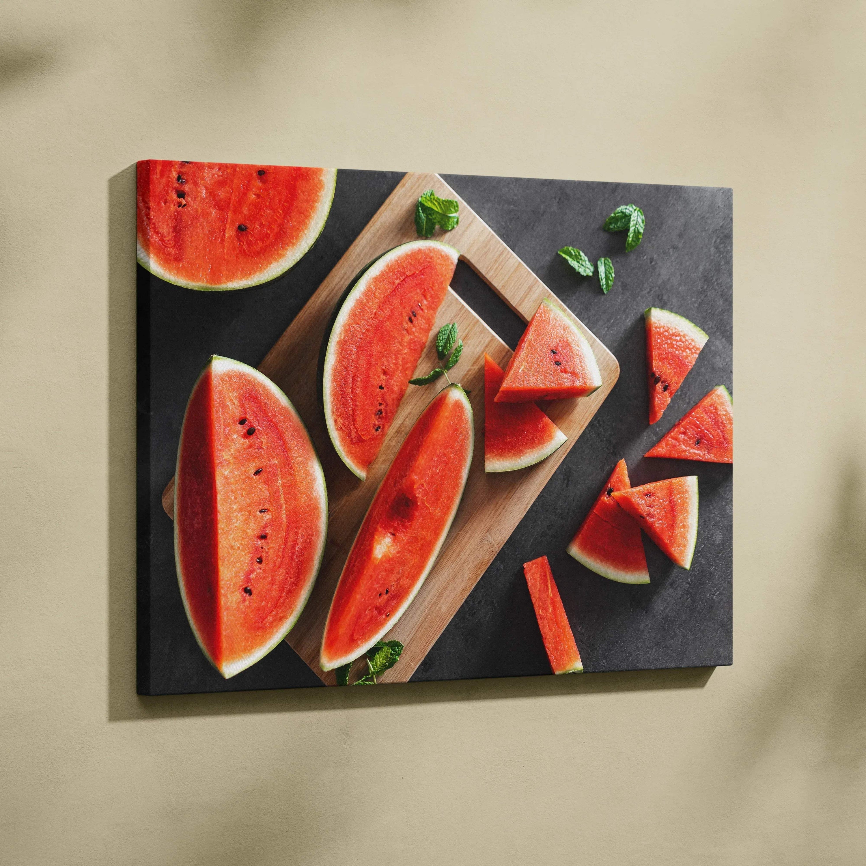 Canvas wall art featuring vibrant red watermelon slices with green rinds on a dark background for home decor.