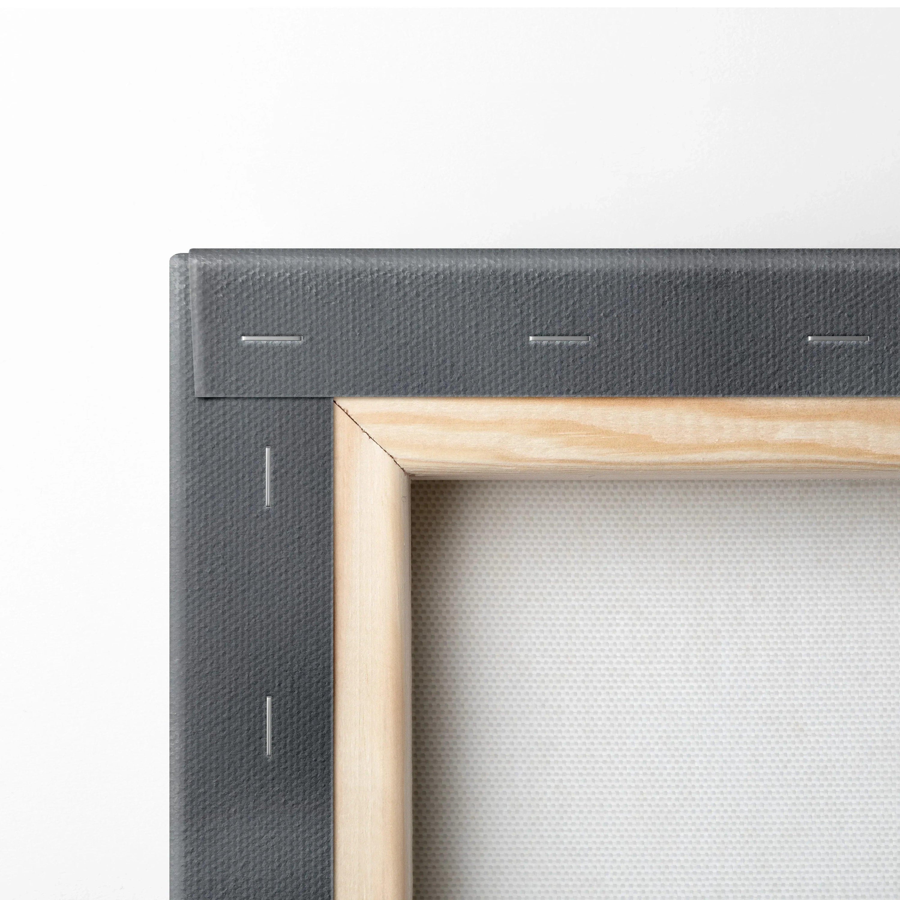 Close-up of stretched canvas wall art corner with wooden frame and black backing for modern decor.