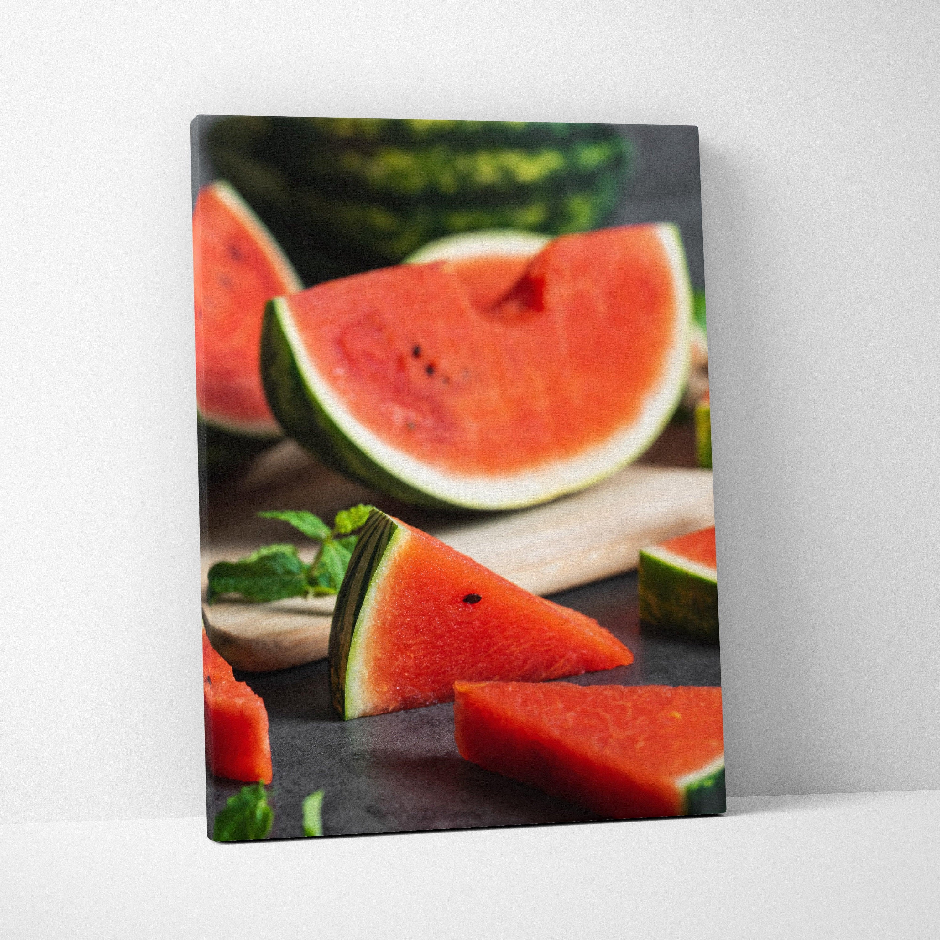 Watermelon canvas wall art featuring vibrant red fruit slices on dark background for modern decor.