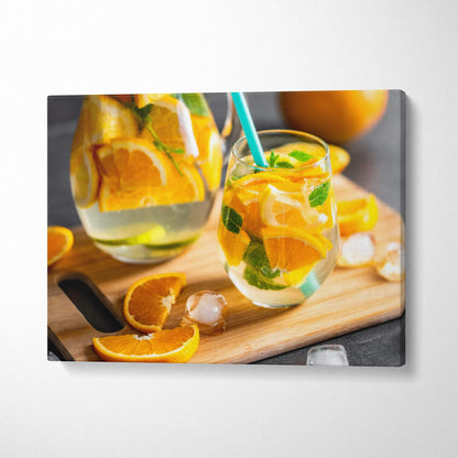 Canvas wall art featuring vibrant sliced oranges and refreshing citrus drinks on wooden board decor.