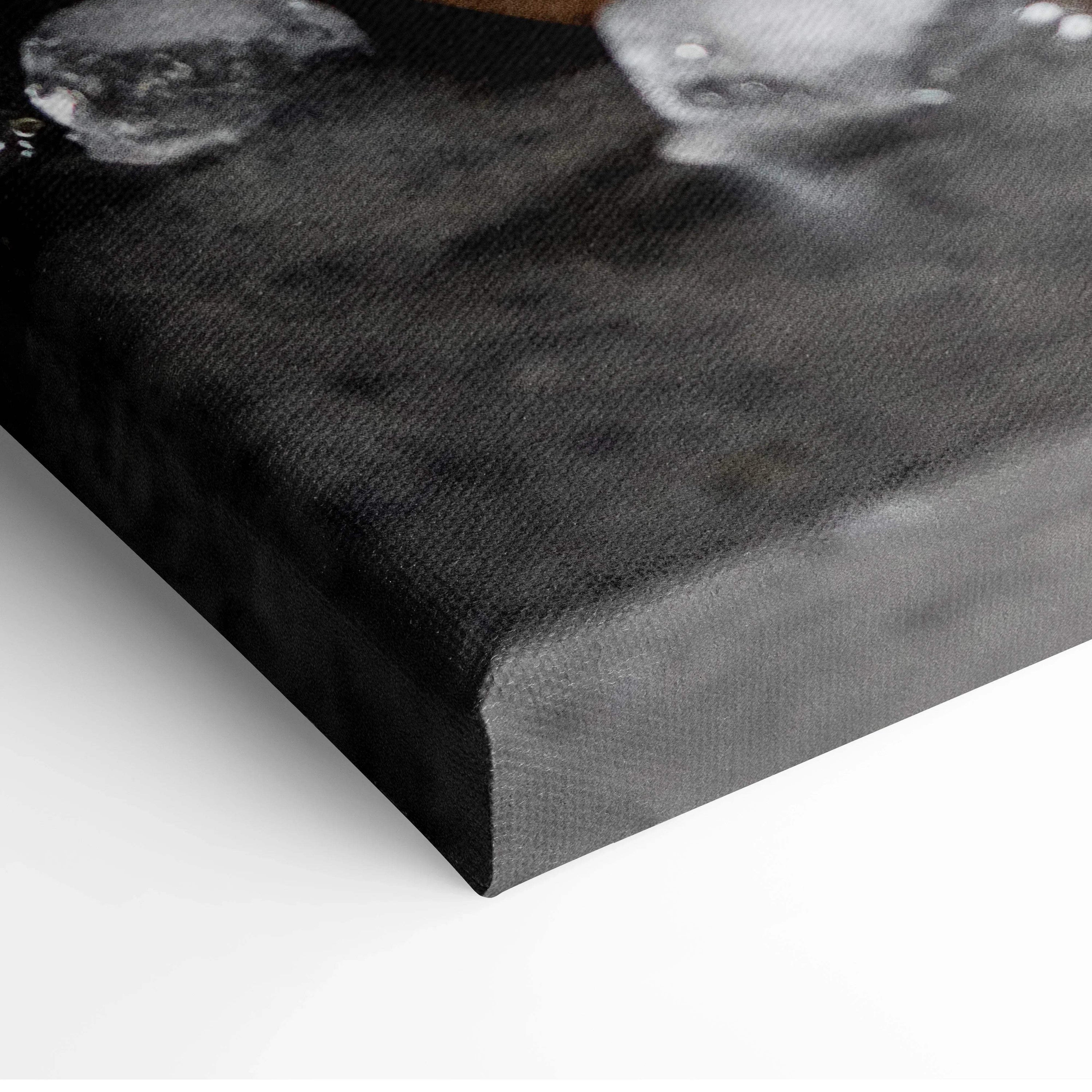 Close-up of textured canvas wall art corner with dark abstract background for modern decor.