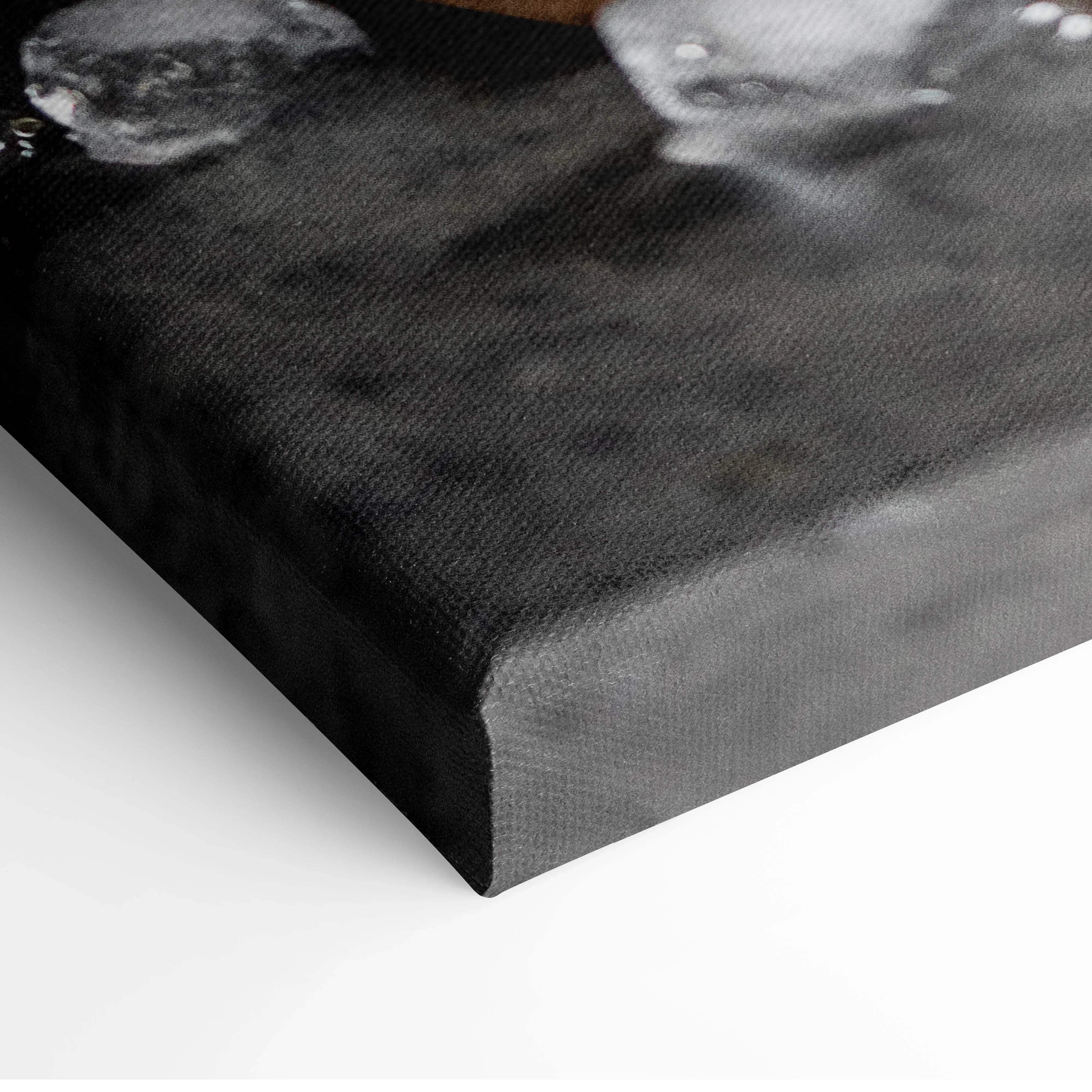 Black canvas print with textured surface featuring grayscale skull imagery paired with modern vibrant orange slices wall art