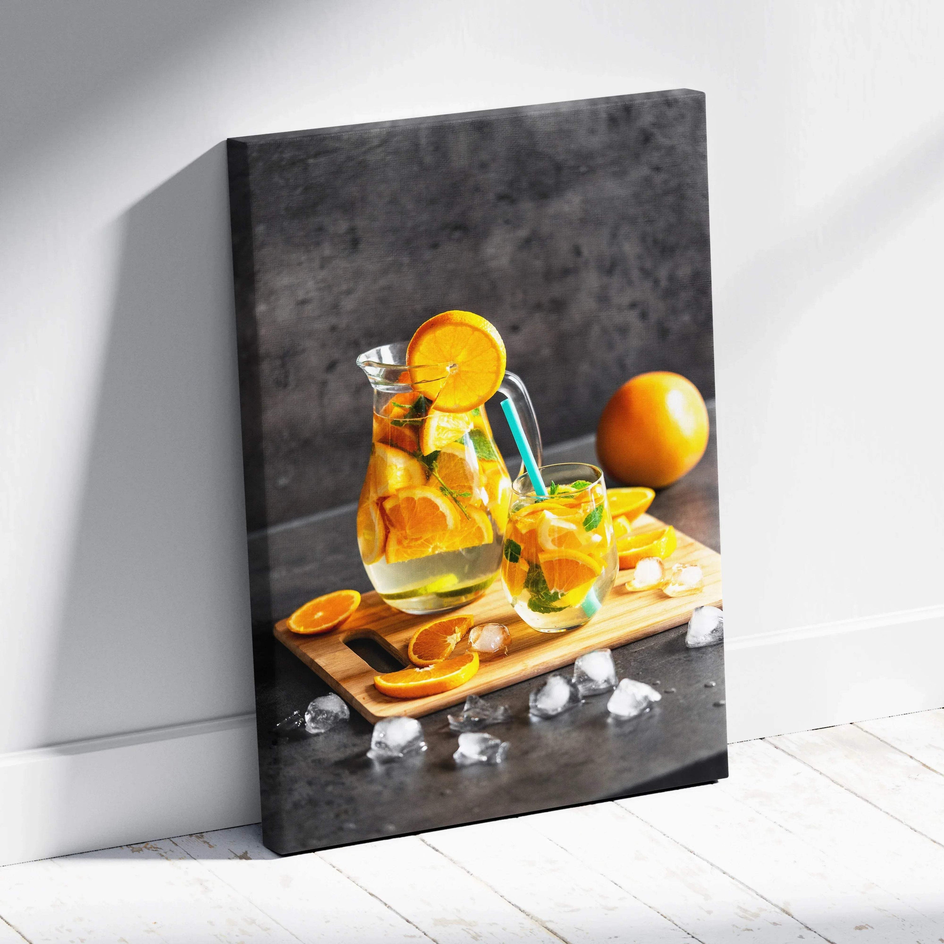 Canvas wall art featuring fresh orange slices in a water glass on a wooden tray with ice cubes, kitchen decor.