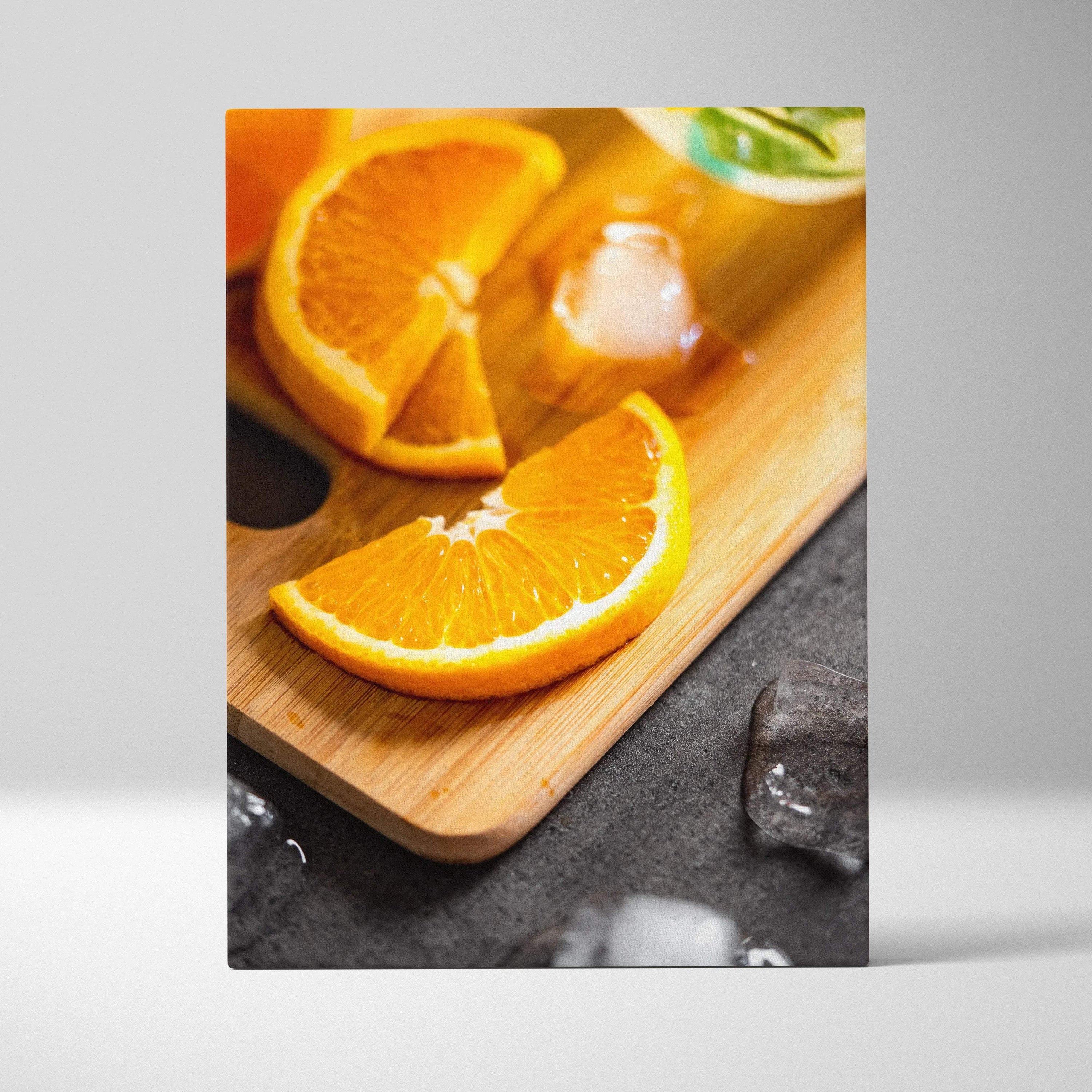 Vibrant orange slices on wooden board with ice cubes high-resolution art canvas wall decor.