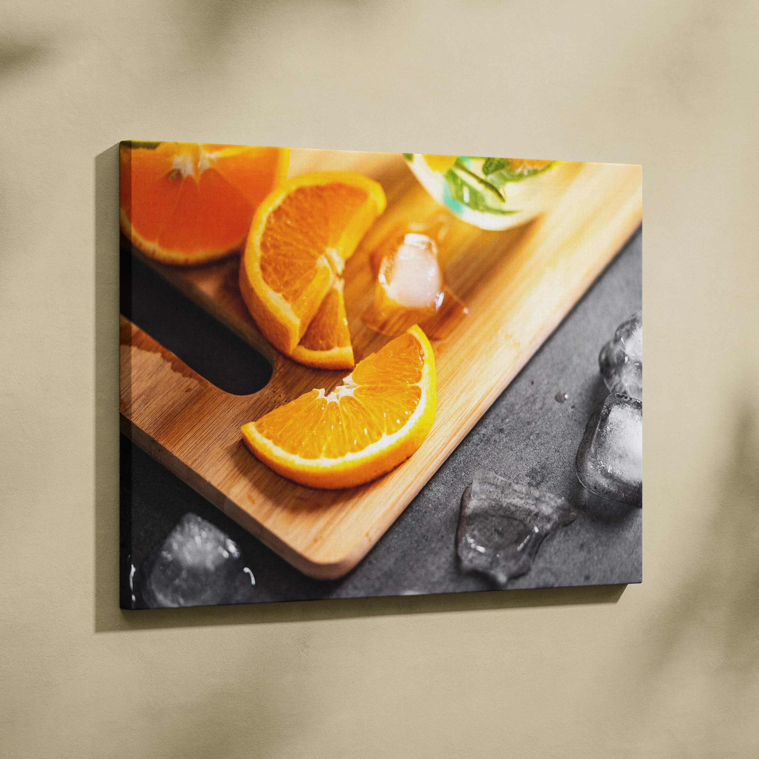 Canvas wall art featuring vibrant sliced oranges on a wooden board with ice, fresh decor.