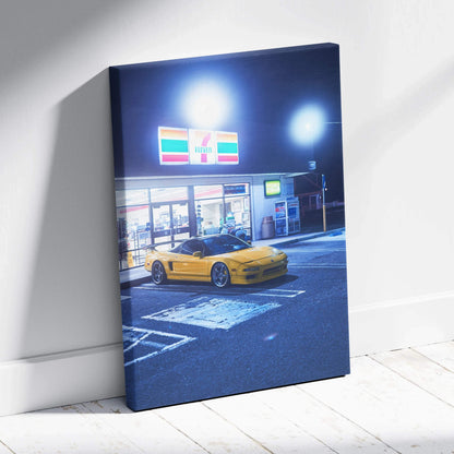 Canvas art of a yellow Acura NSX parked at a brightly lit 7-Eleven at night, vertical wall art.
