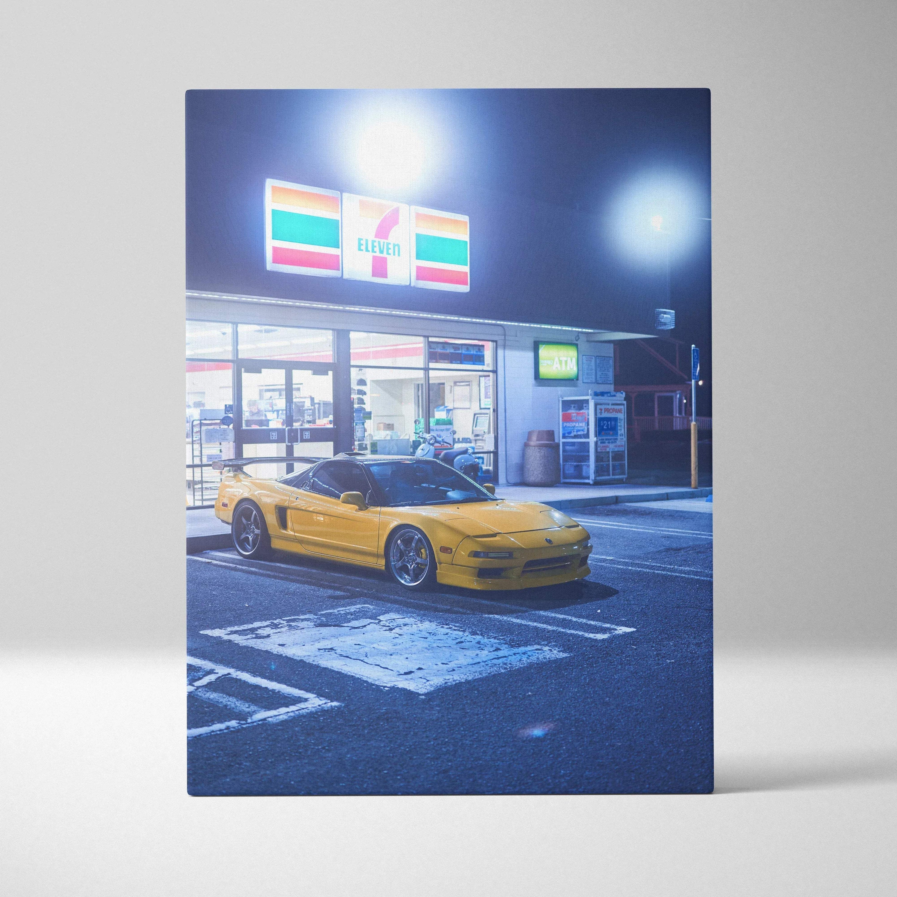 Acura NSX yellow sports car in front of illuminated 7-Eleven store at night vertical canvas wall art.