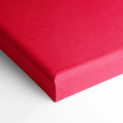 Close-up of red canvas stretched over wooden frame with visible texture and clean edges.