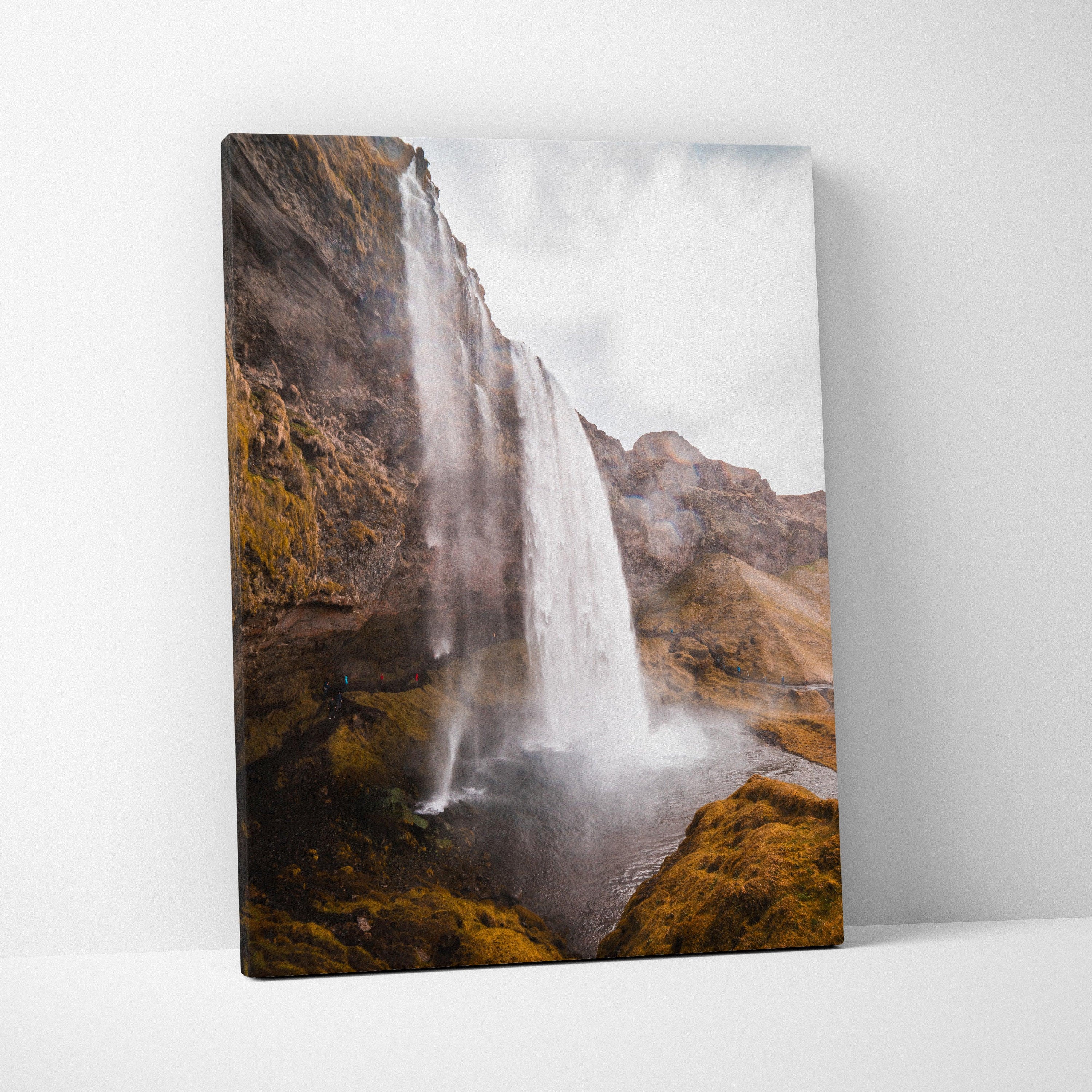 Canvas wall art featuring a high-resolution Iceland waterfall landscape with rocky cliffs and mist.