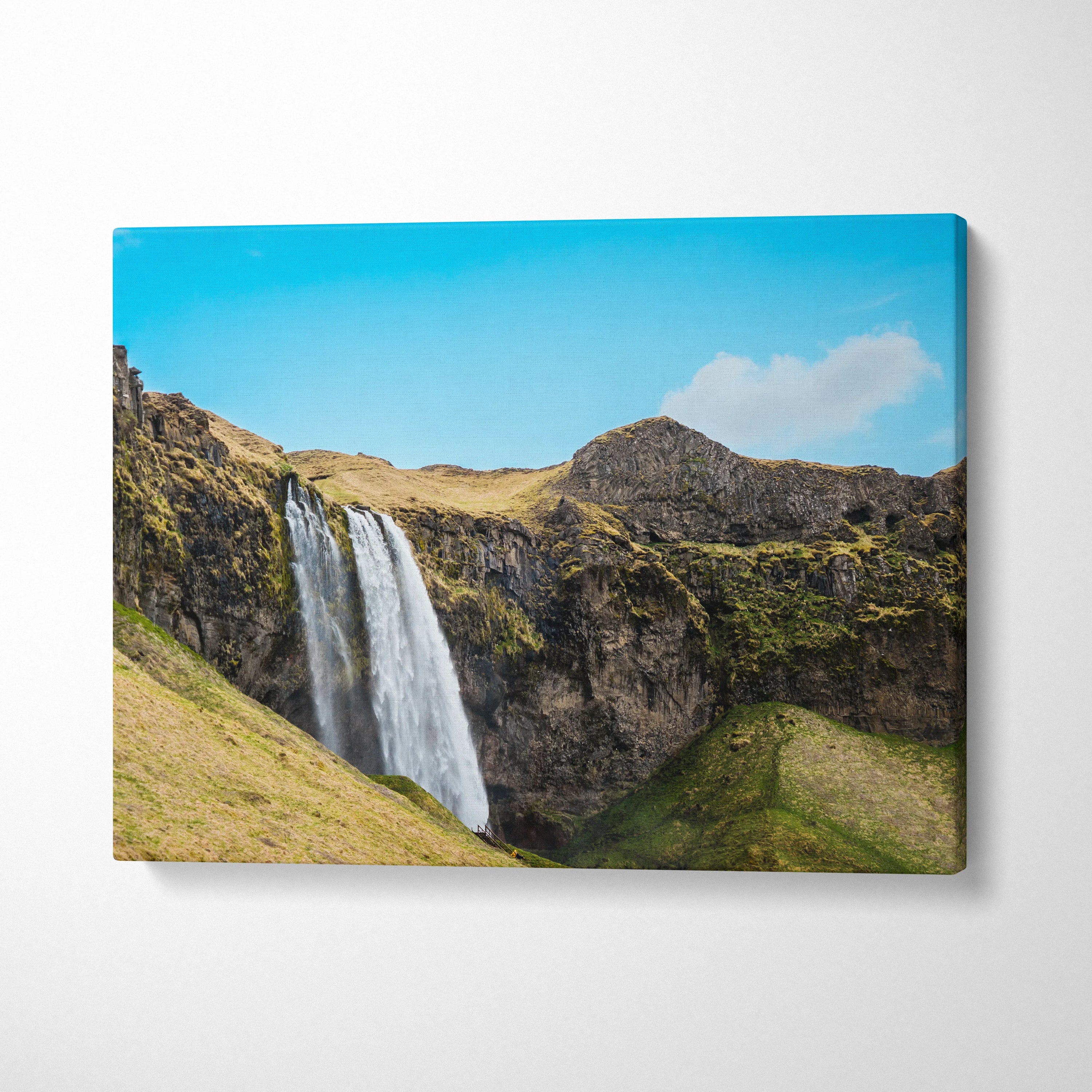 Icelandic waterfall nature landscape canvas wall art with blue sky and rocky cliffs decor.