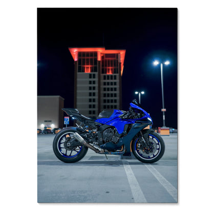 Blue Yamaha R1 motorcycle parked under streetlights at night poster wall art.