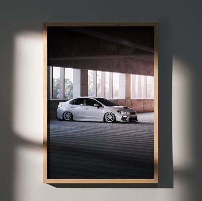 Subaru WRX poster wall art featuring a white WRX in an urban parking structure with dramatic lighting.