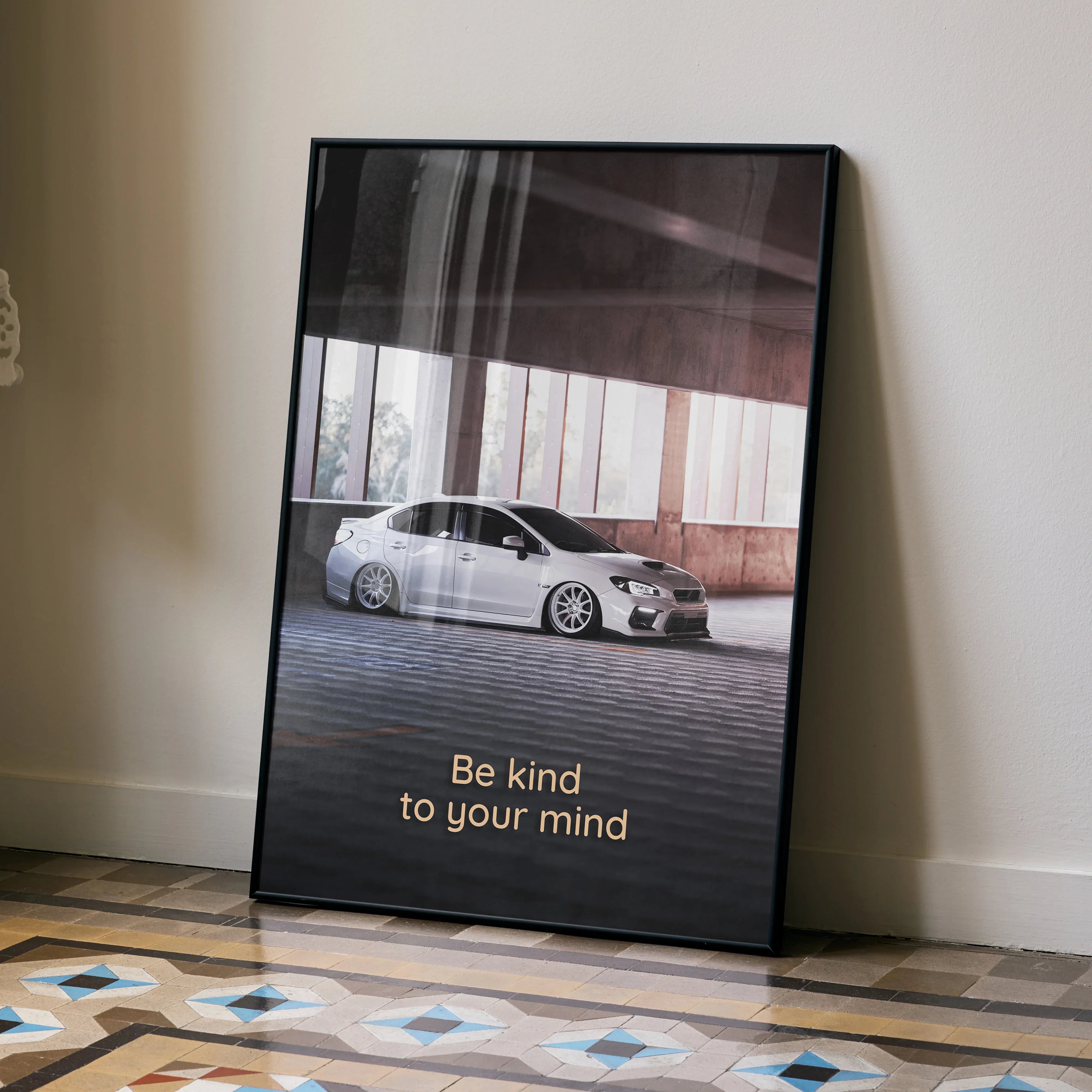 Subaru WRX poster wall art with silver car and motivational text "Be kind to your mind" in bold font.