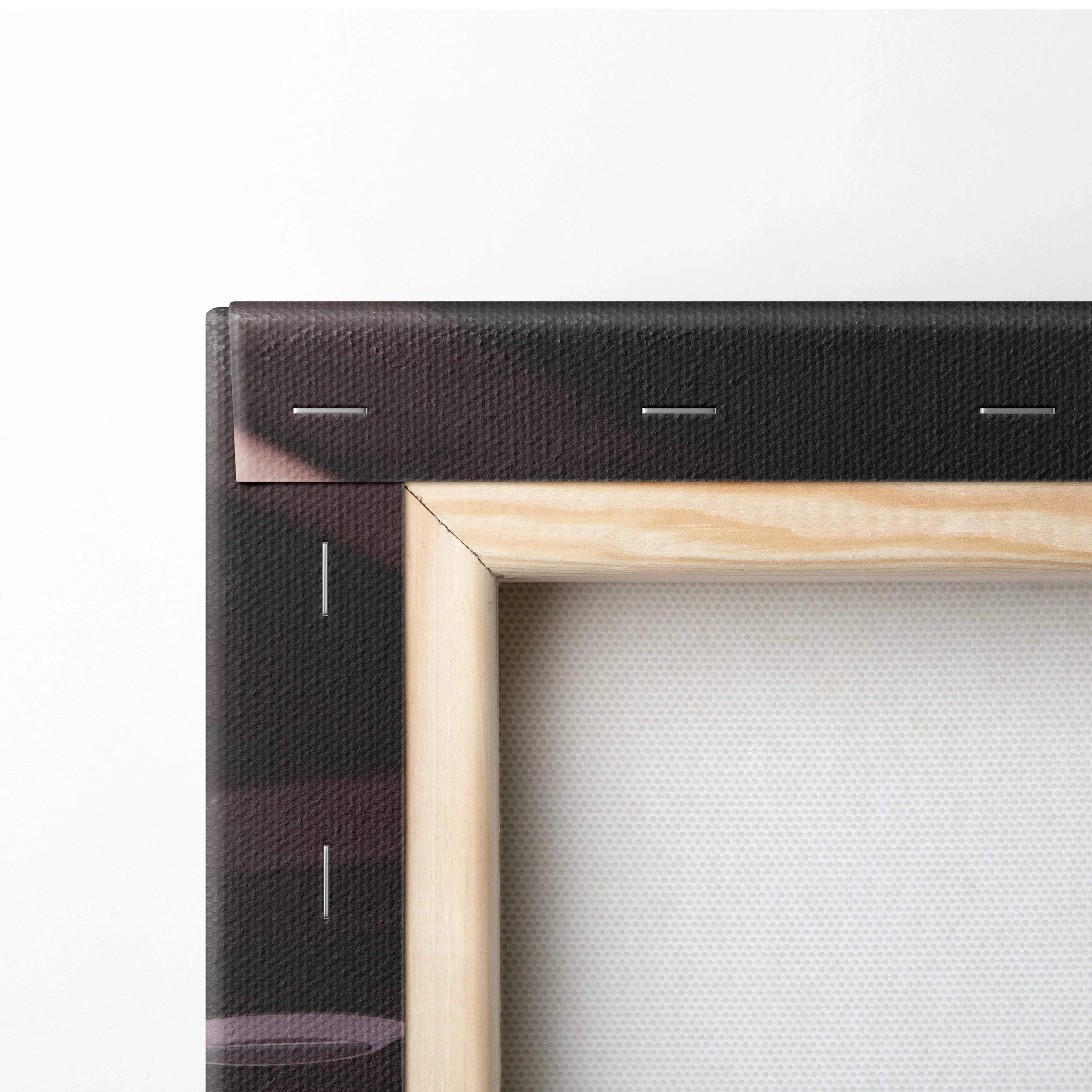 Close-up of wooden frame and black stretched canvas corner showcasing museum-quality wall art canvas texture.
