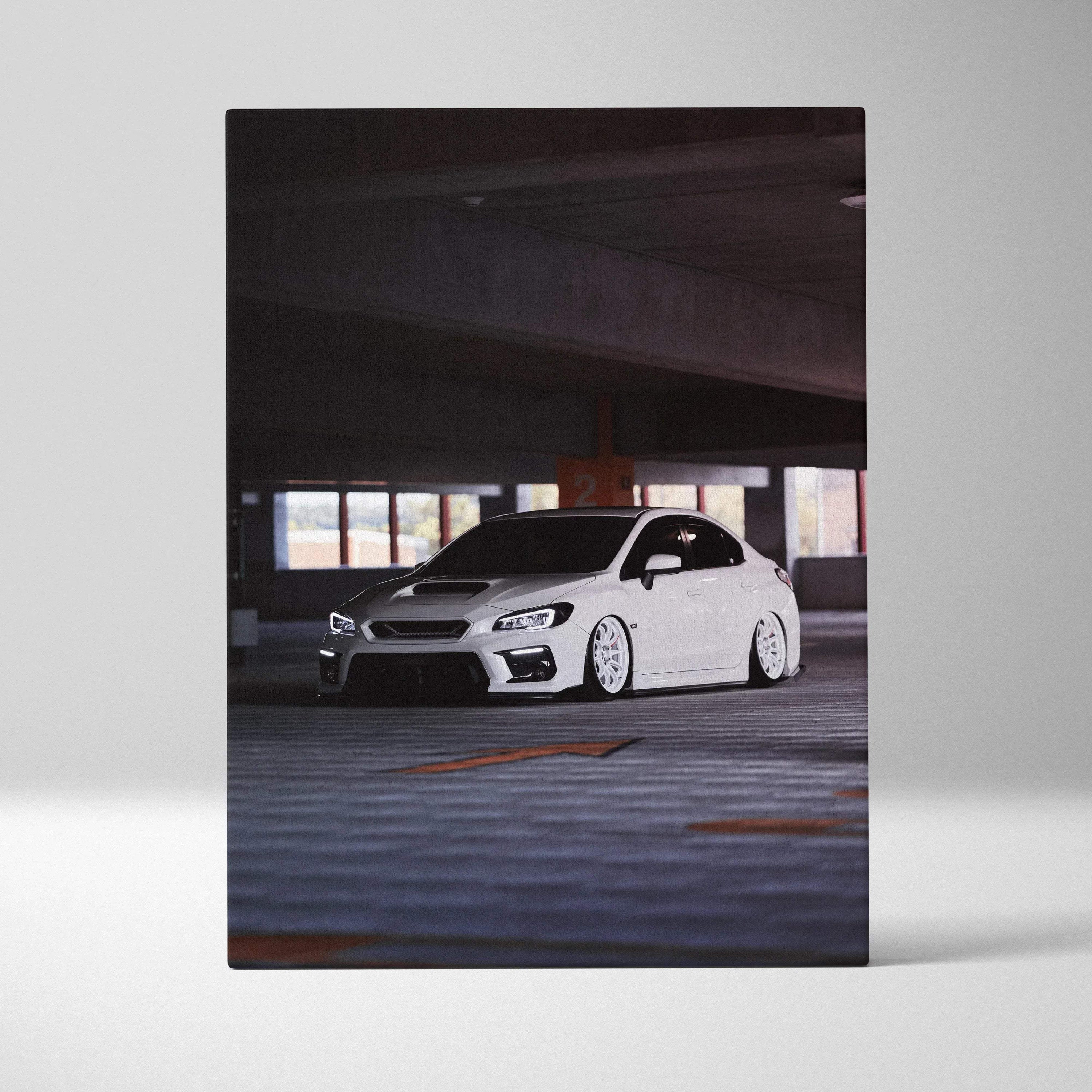 Vertical canvas art featuring a white Subaru WRX in a dimly lit parking garage wall art print.