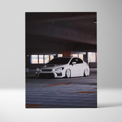 Vertical canvas art featuring a white Subaru WRX in a dimly lit parking garage wall art print.