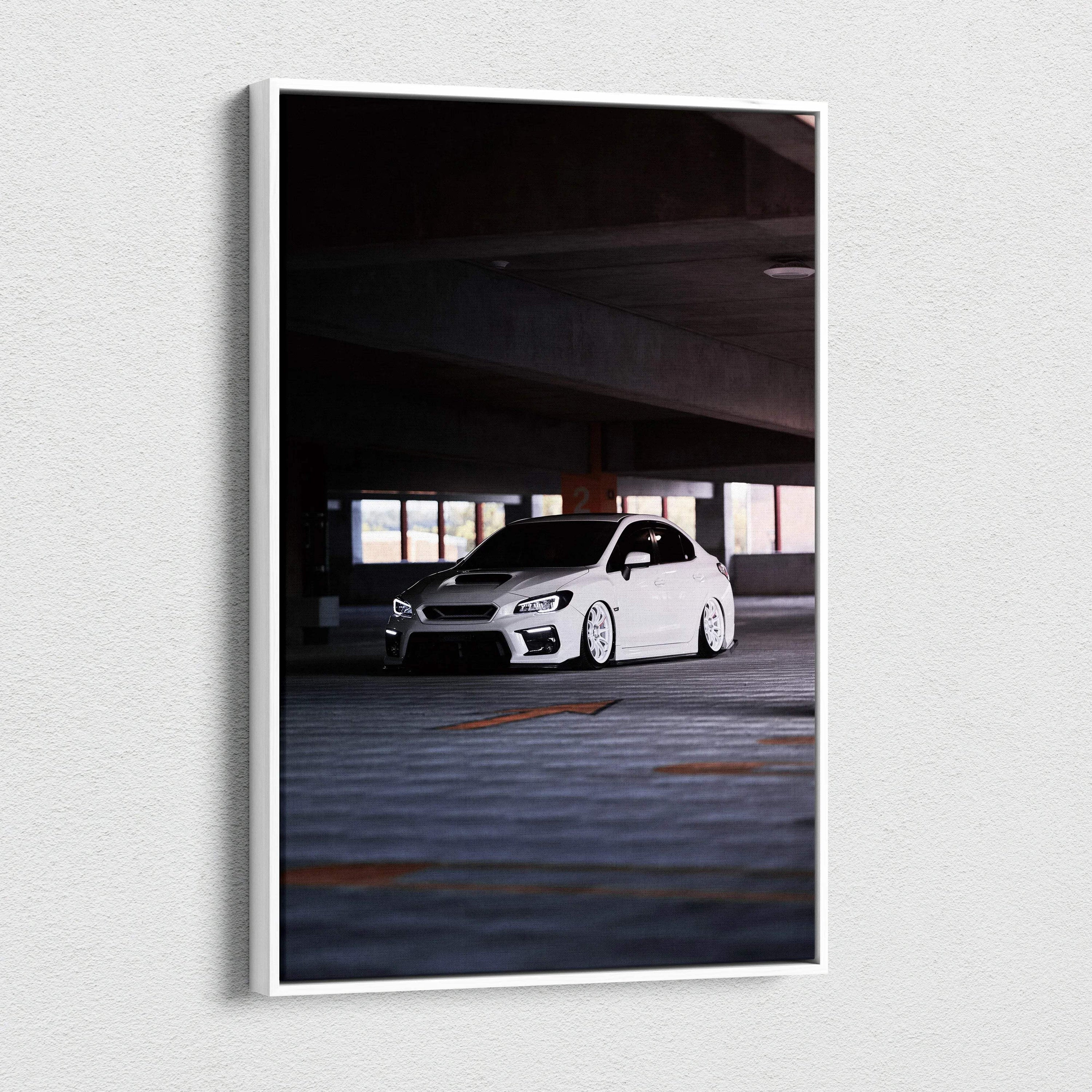 White Subaru WRX parked in dark garage on vertical canvas wall art print.