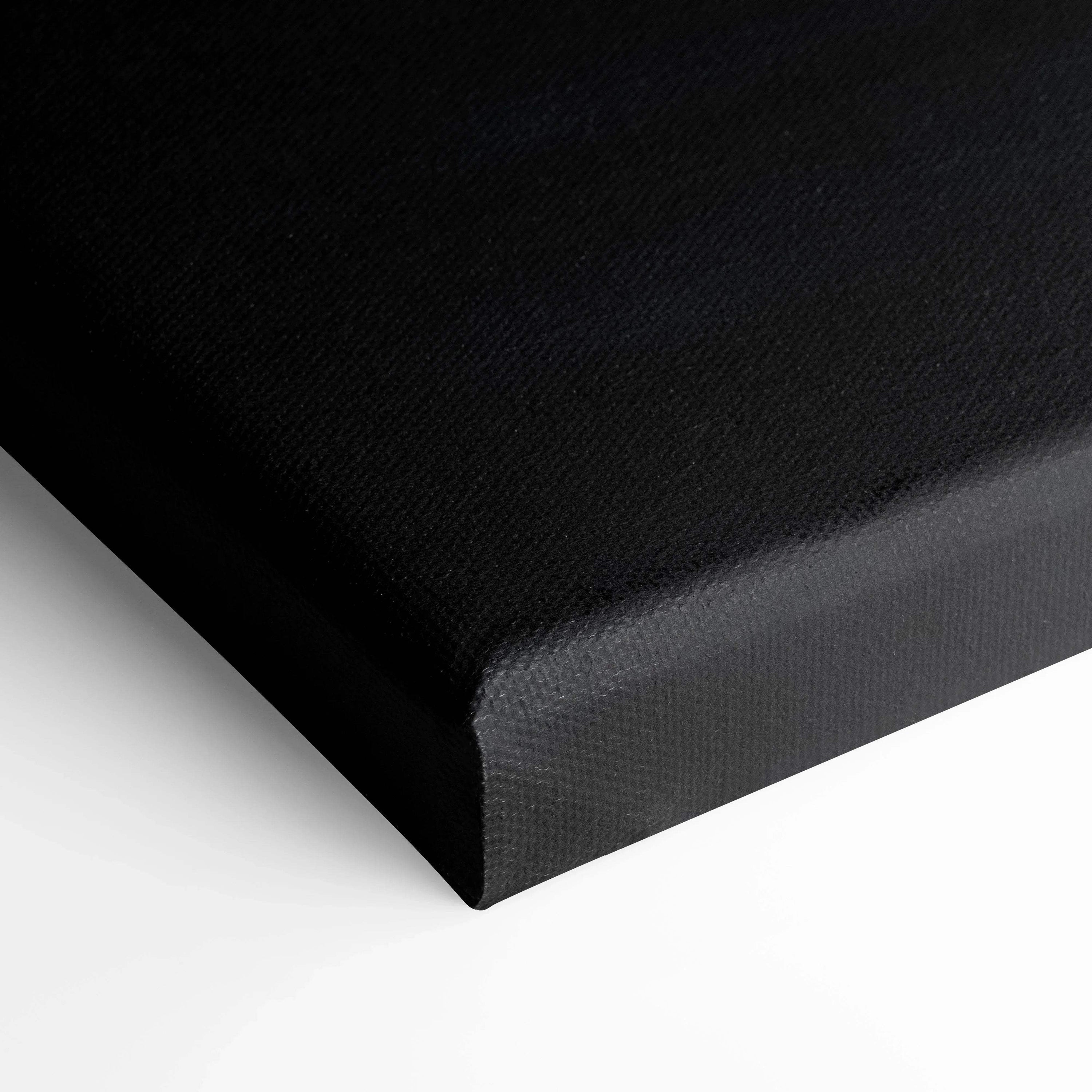 Black tight-wrapped canvas corner with fine texture showcasing premium wall art quality.