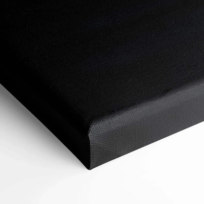 Black tight-wrapped canvas corner with fine texture showcasing premium wall art quality.