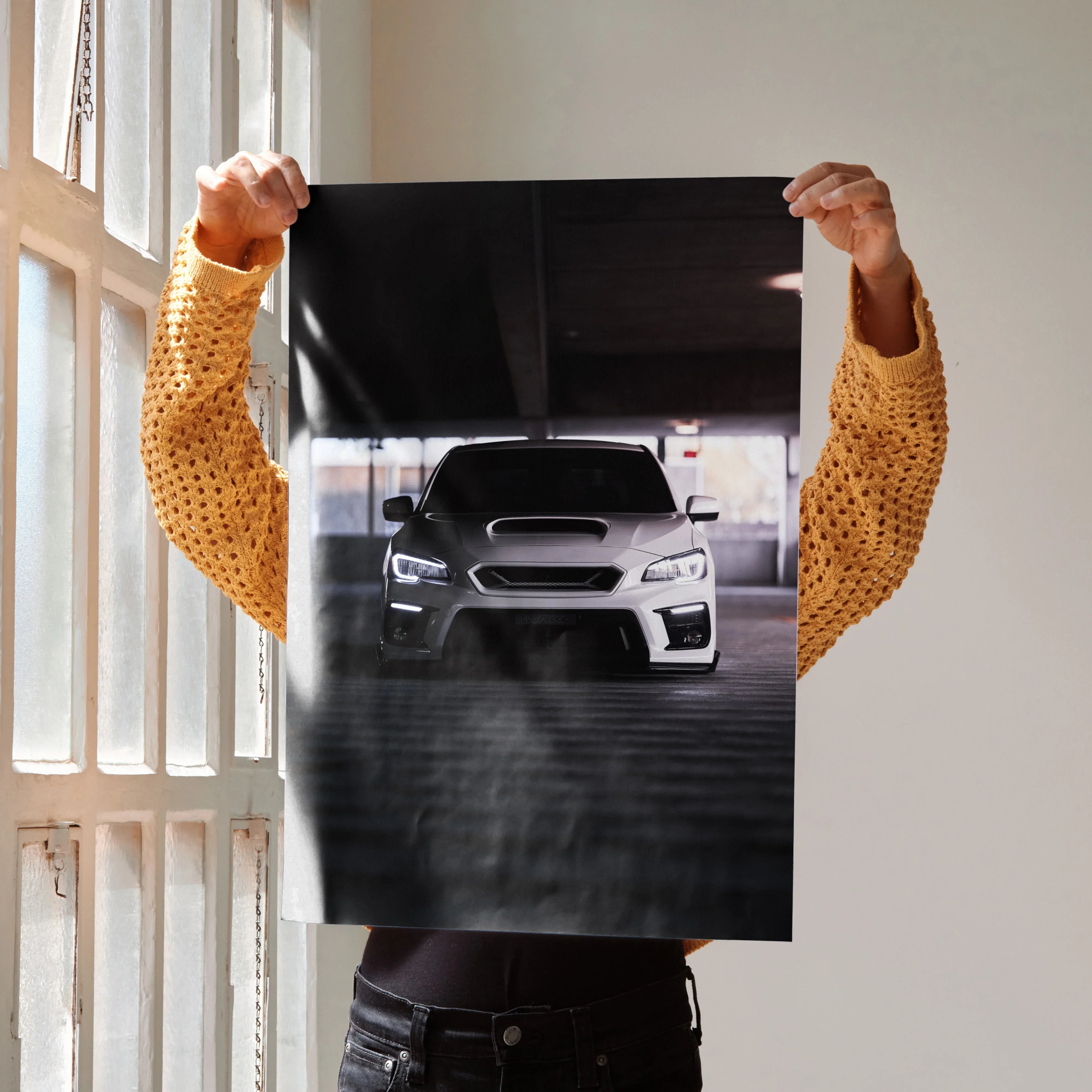 Subaru WRX front view poster with headlights on, sleek automotive wall art on dark background.