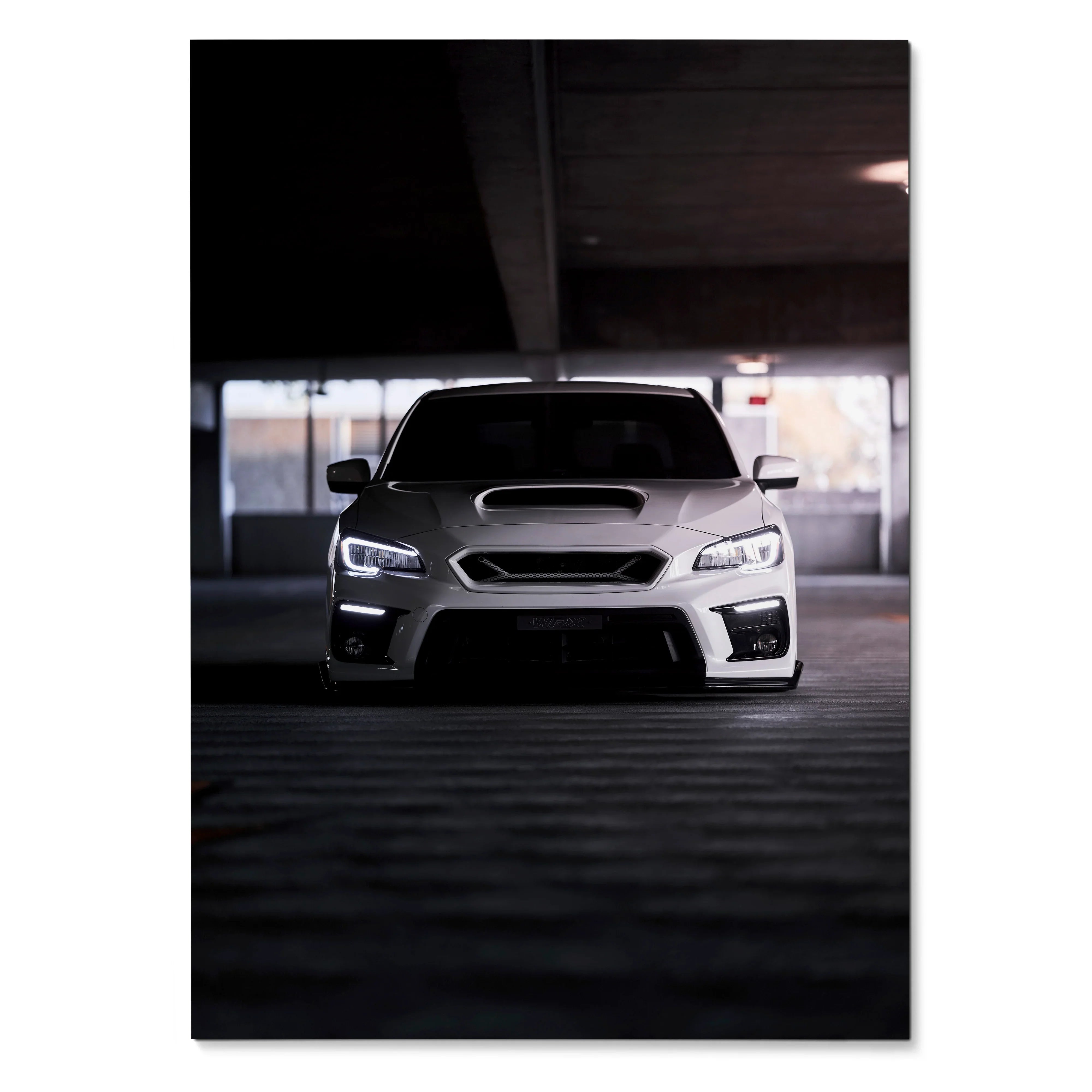 Subaru WRX front view poster with illuminated headlights in dark parking garage wall art.