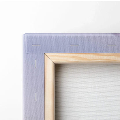 Close-up of wooden frame and purple canvas back showing texture and staples on wall art canvas print.