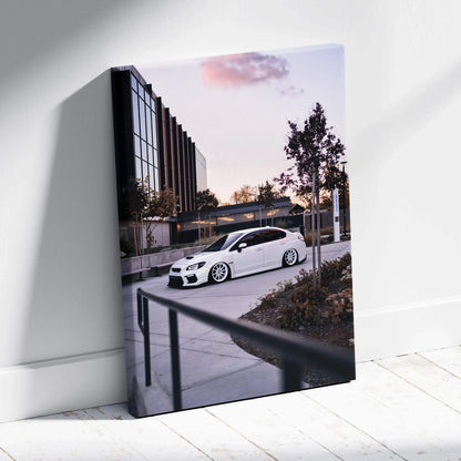 Subaru WRX white sports car parked outside modern building canvas wall art in vertical format.