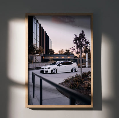 Subaru WRX white car parked at sunset modern urban setting poster wall art in wooden frame.