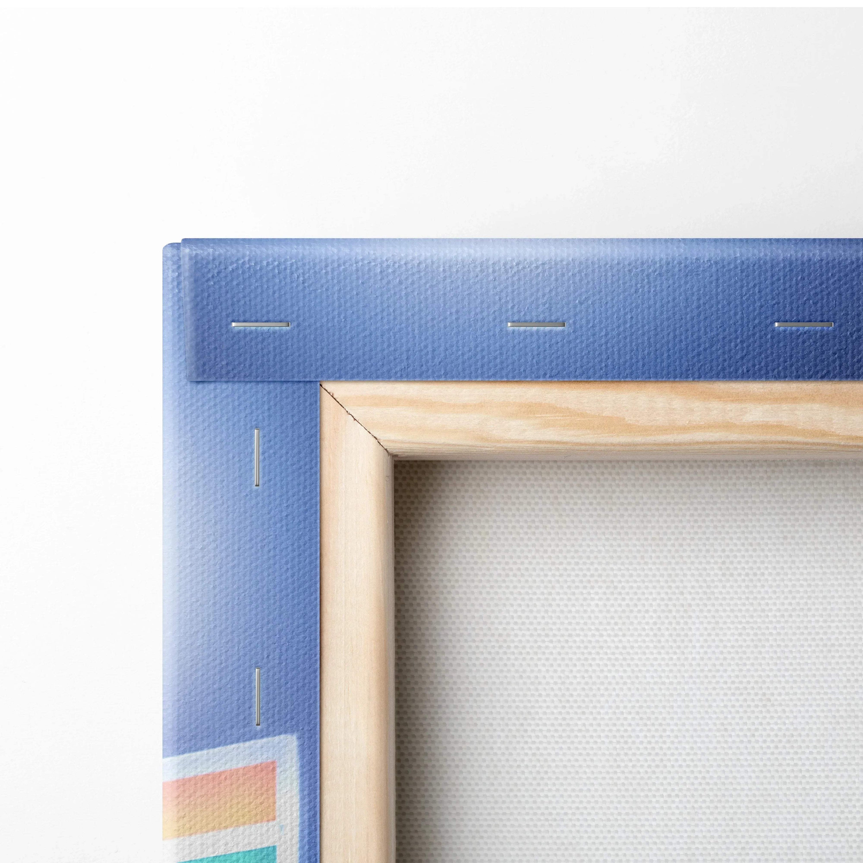Close-up of corner of blue canvas stretched on wood frame showcasing texture and staple details for wall art canvas print.