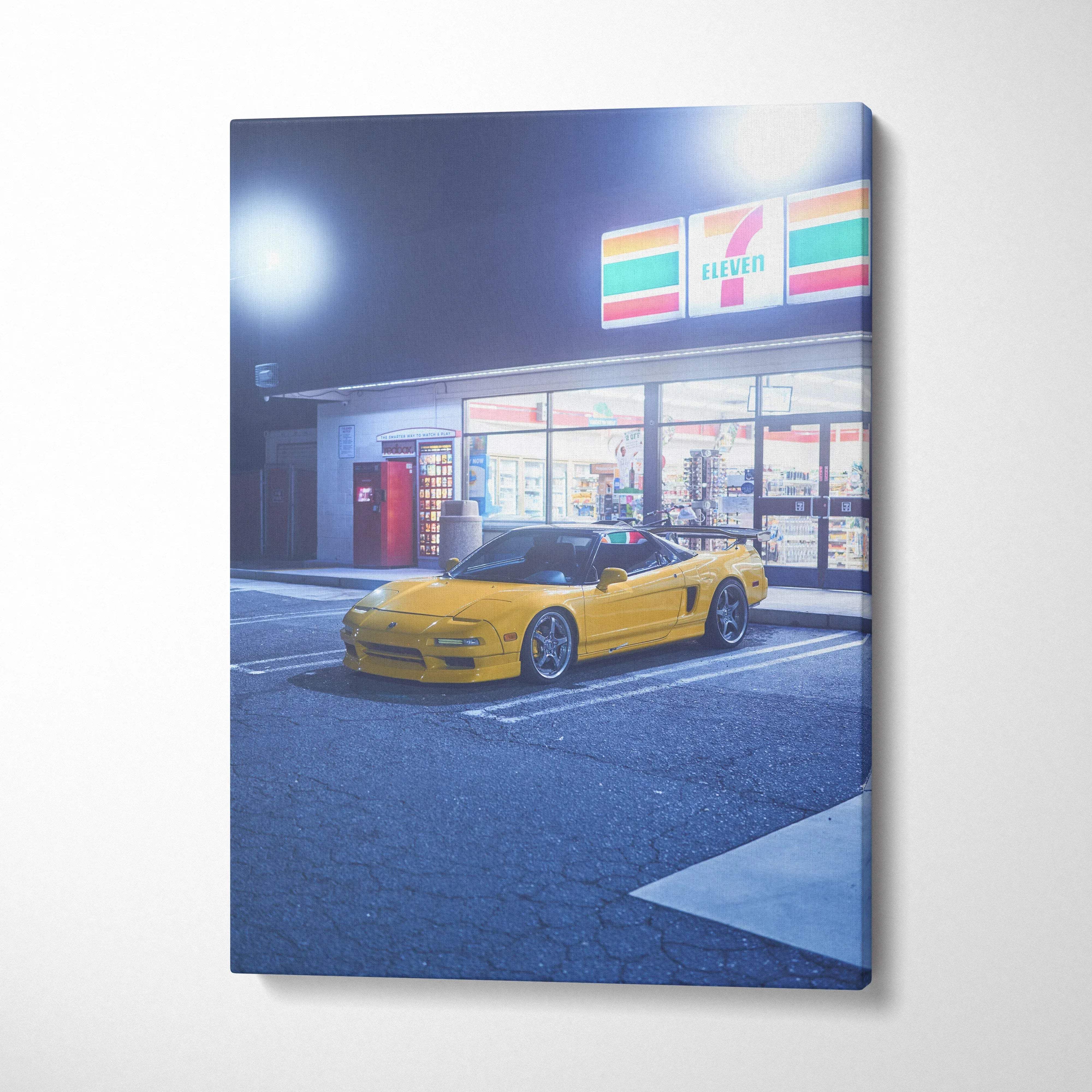 Yellow Acura NSX sports car at night outside 7-Eleven on vertical canvas wall art.