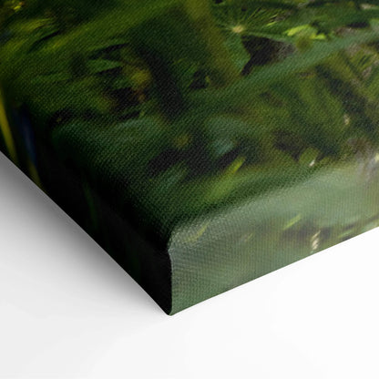Close-up of canvas wall art showing textured, high-resolution floral design with green leaves and pink cherry blossoms.