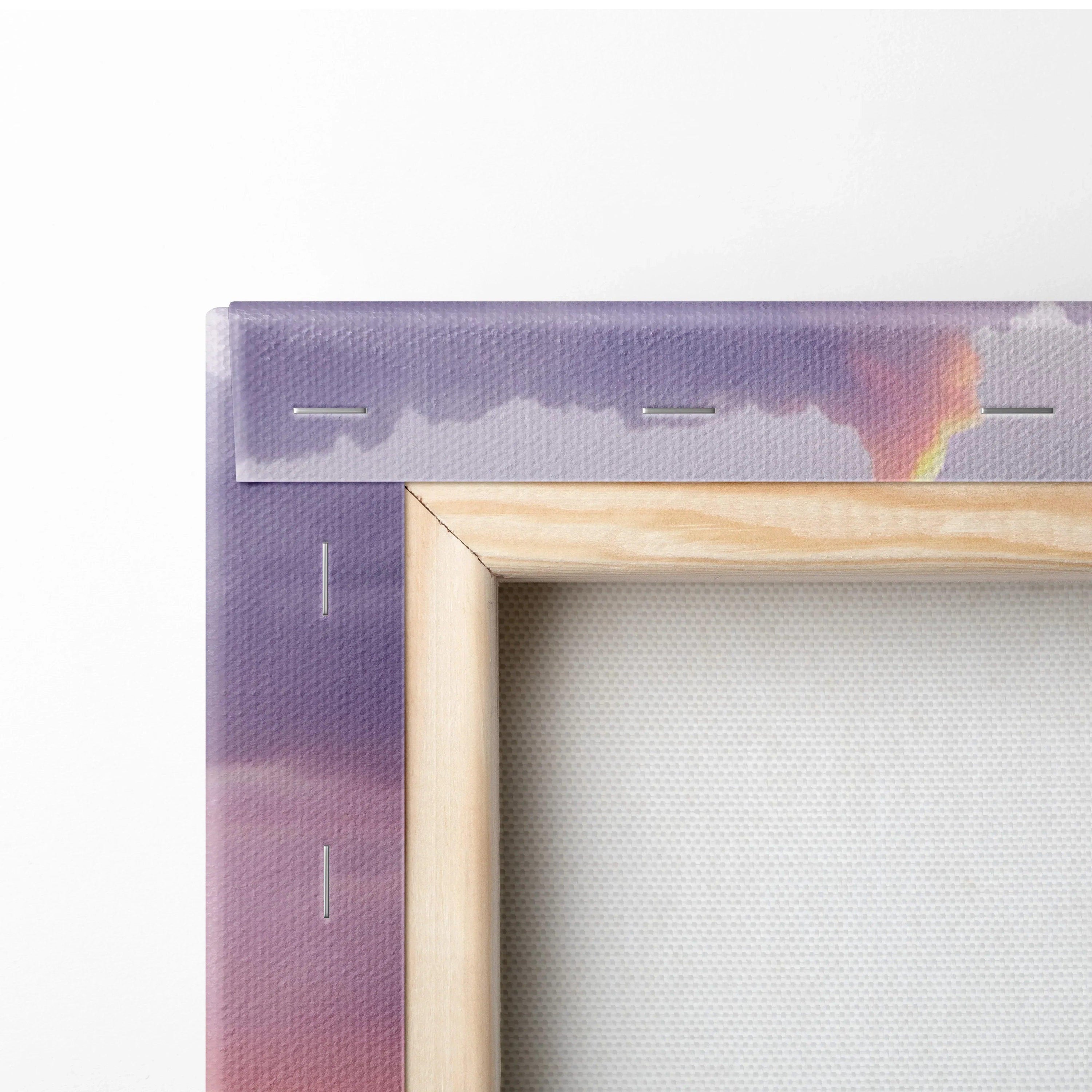 Close-up of stretched canvas showing wooden frame and sunset purple sky wall art edges.