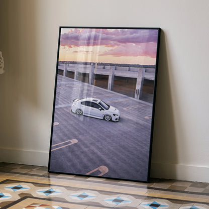 Subaru WRX parked on wooden pier at sunset poster wall art with purple and orange sky.