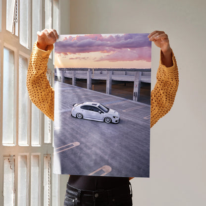 Subaru WRX poster wall art featuring white car on pier at sunset with purple and orange sky.