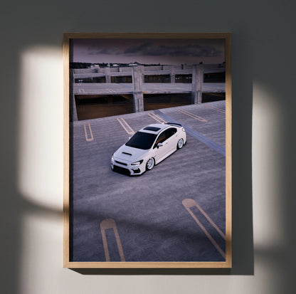Subaru WRX white car in empty parking lot poster wall art with moody lighting and shadow.