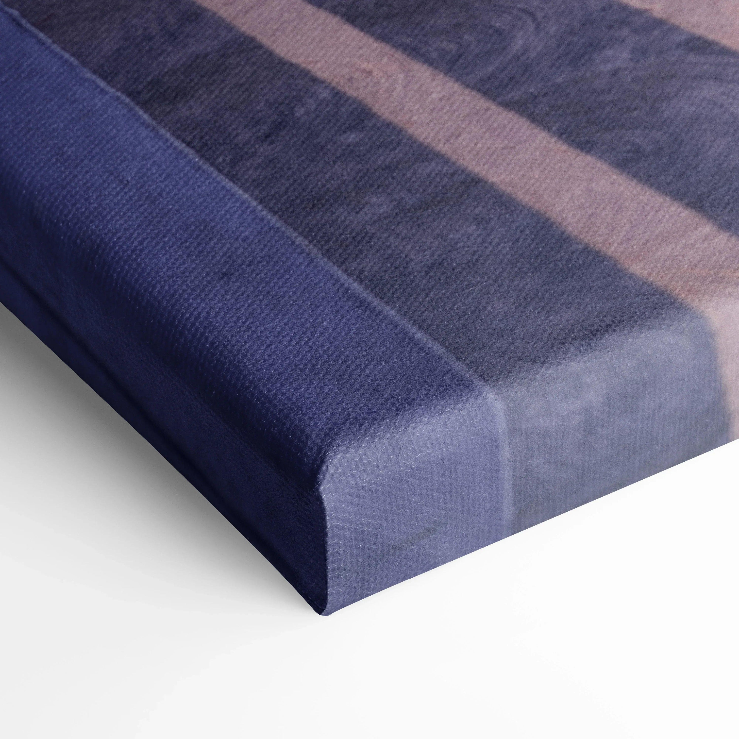 Close-up of deep blue canvas wall art with fine texture and museum-quality finish.