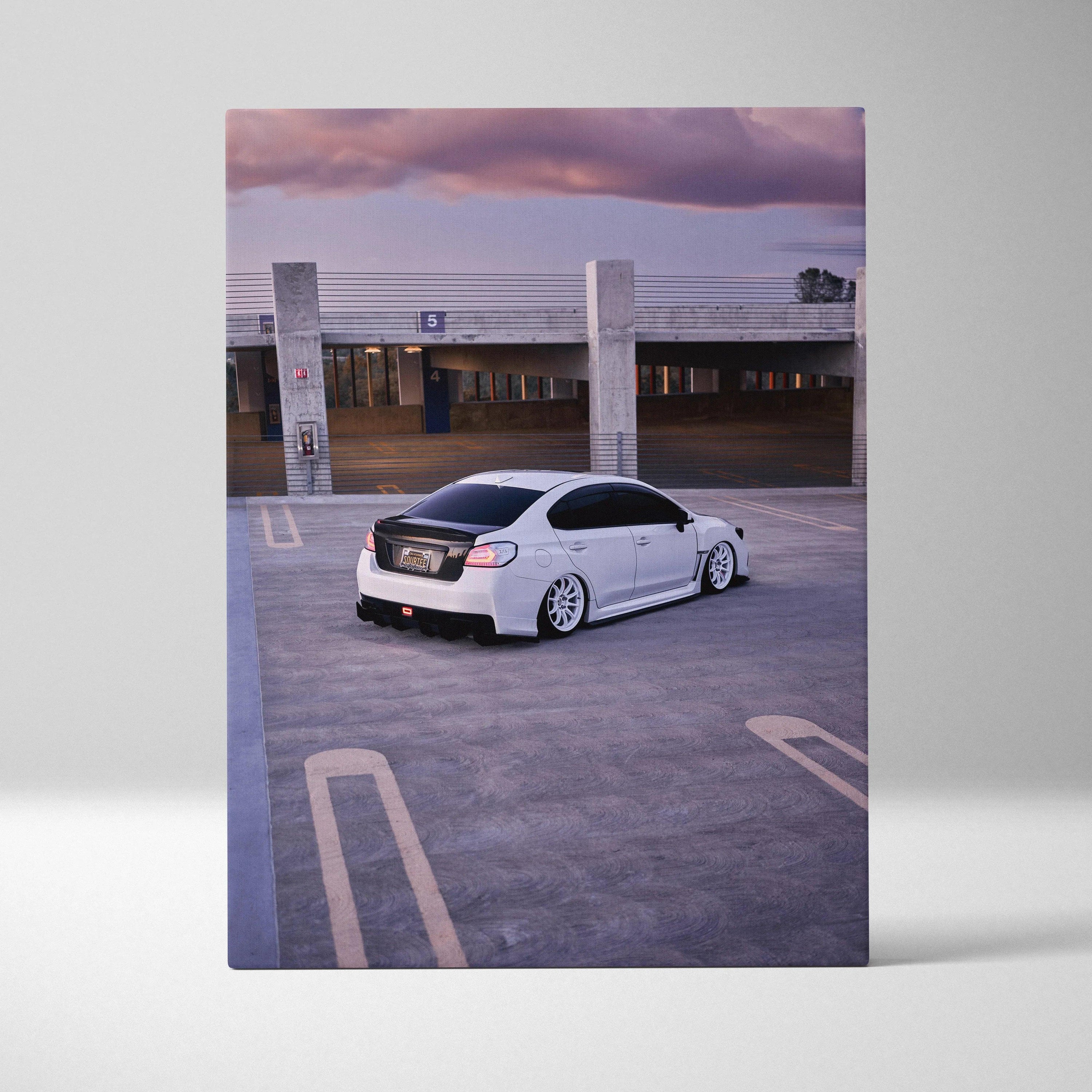 White Subaru WRX on rooftop parking at sunset canvas wall art print.