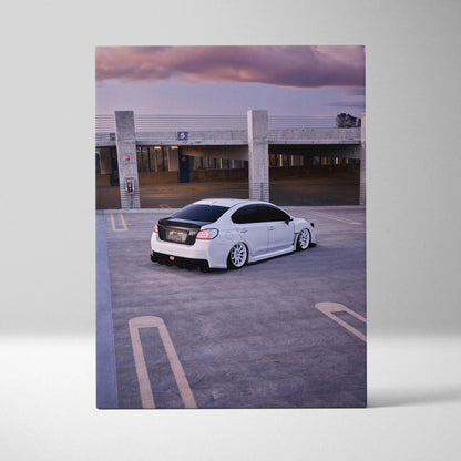 White Subaru WRX on rooftop parking at sunset canvas wall art print.