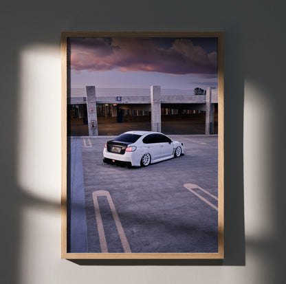 Subaru WRX white car poster wall art with dramatic sky and empty parking lot in wooden frame.