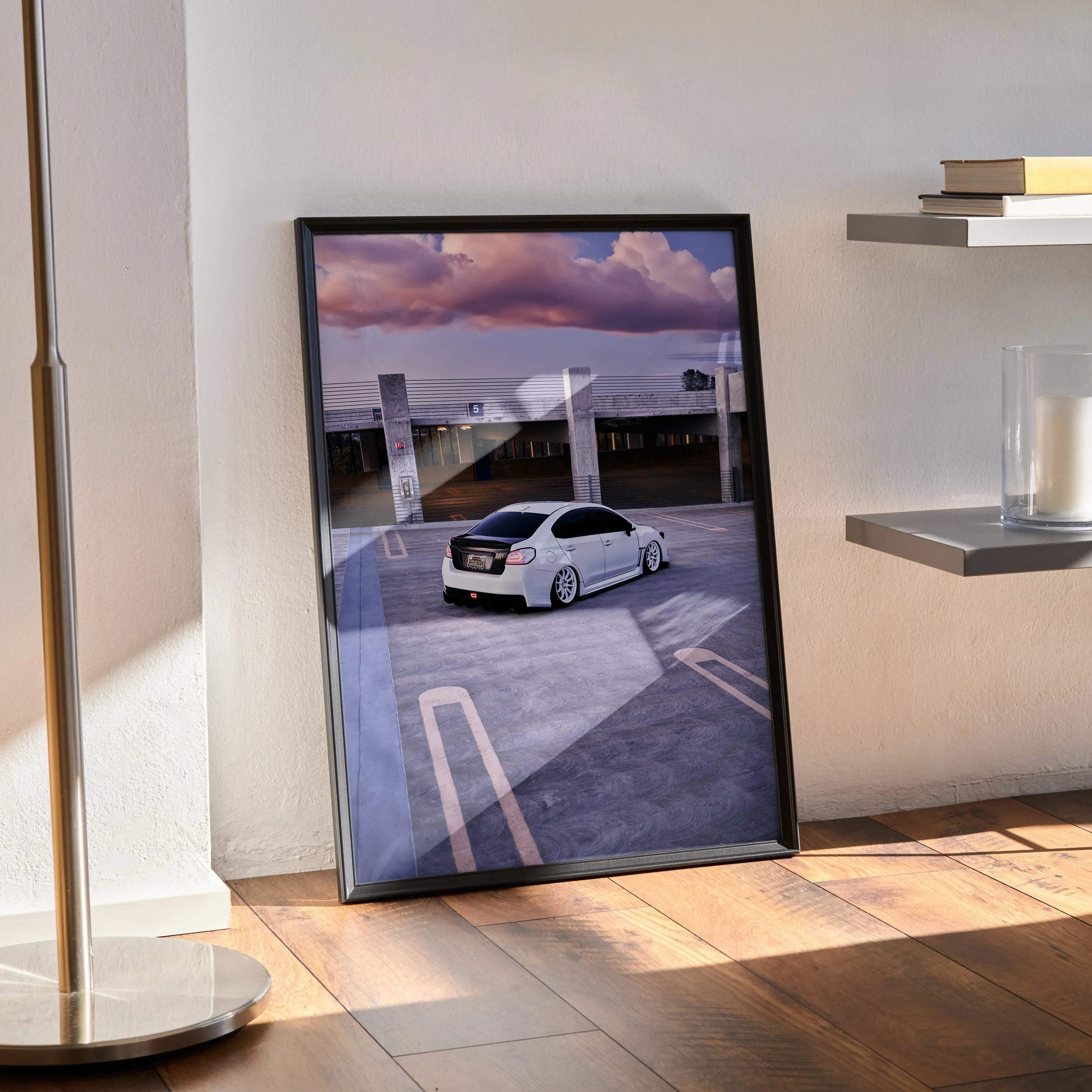 Subaru WRX poster wall art featuring a white car on rooftop with dramatic purple sky in black frame.