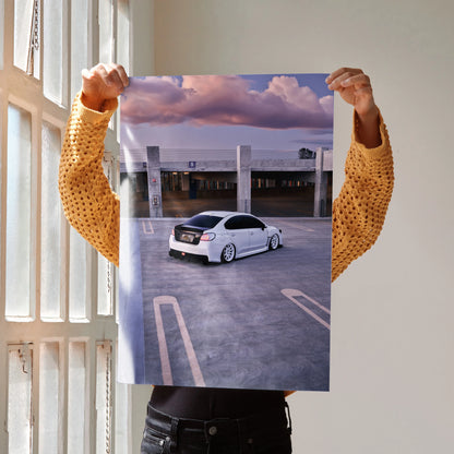 Subaru WRX poster wall art showing white WRX car in empty rooftop parking under cloudy sky.