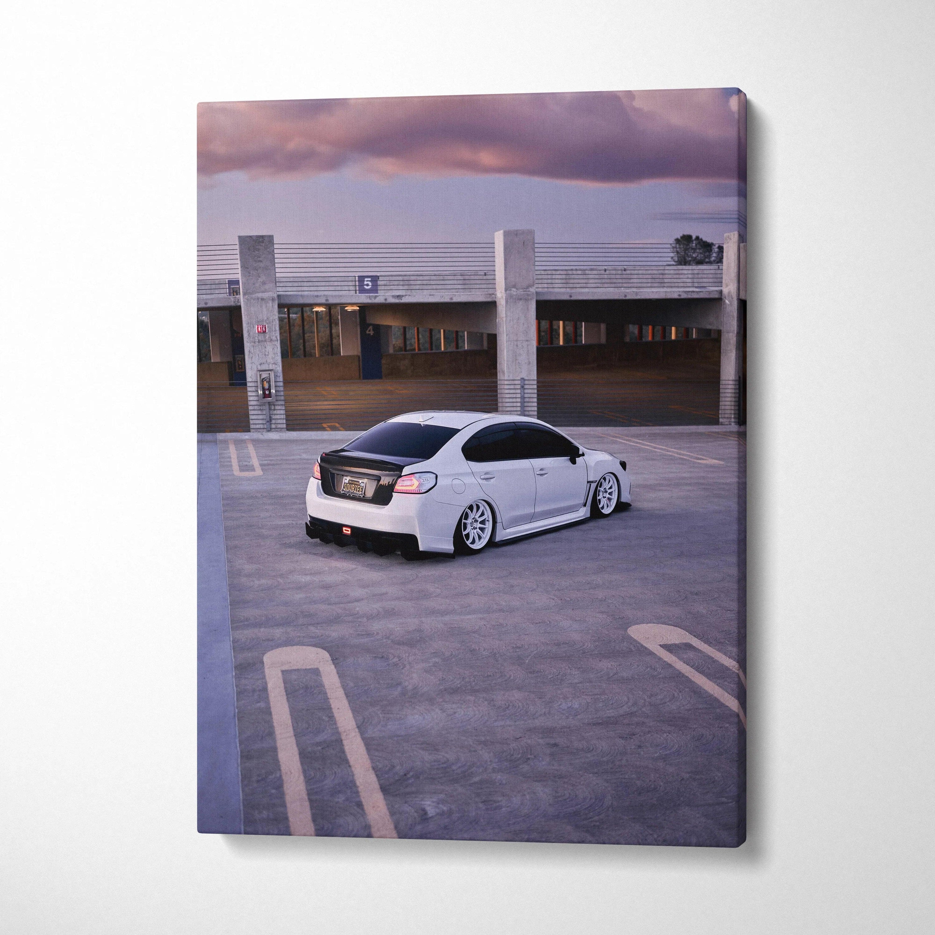 White Subaru WRX parked in rooftop lot at sunset on vertical canvas wall art.