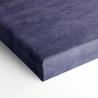 Close-up of textured navy blue canvas wall art with wrap-around edges and museum-quality finish.