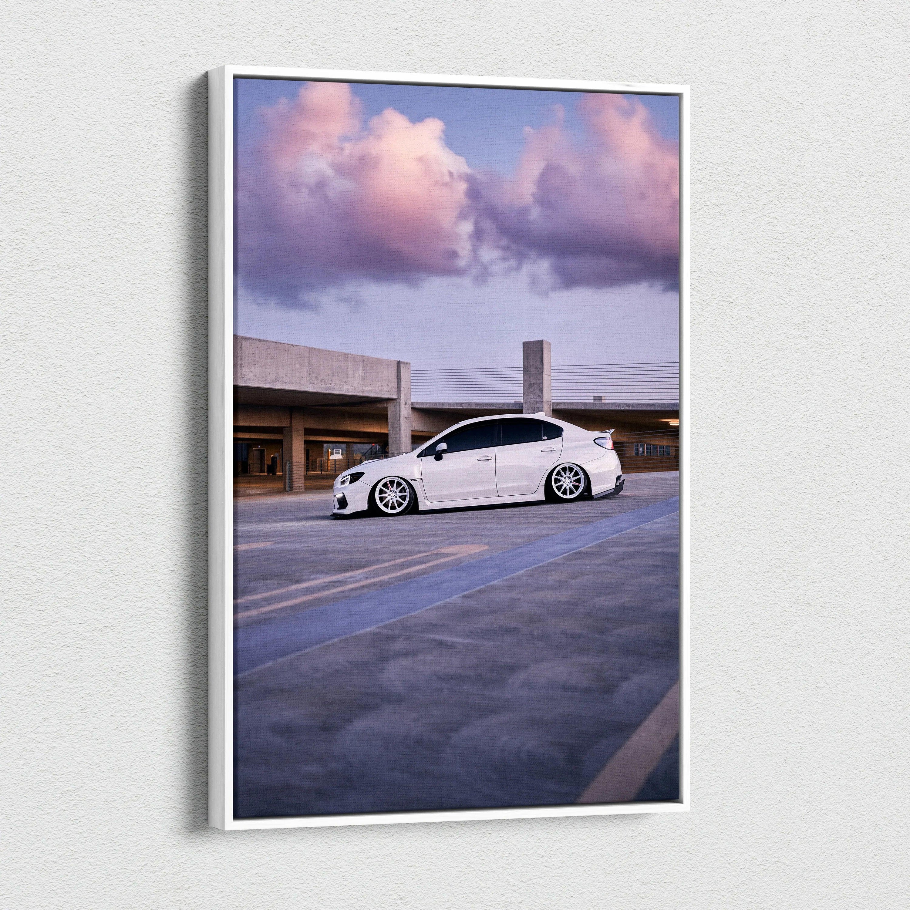 Vertical canvas wall art featuring a white Subaru WRX under a vibrant sunset sky.